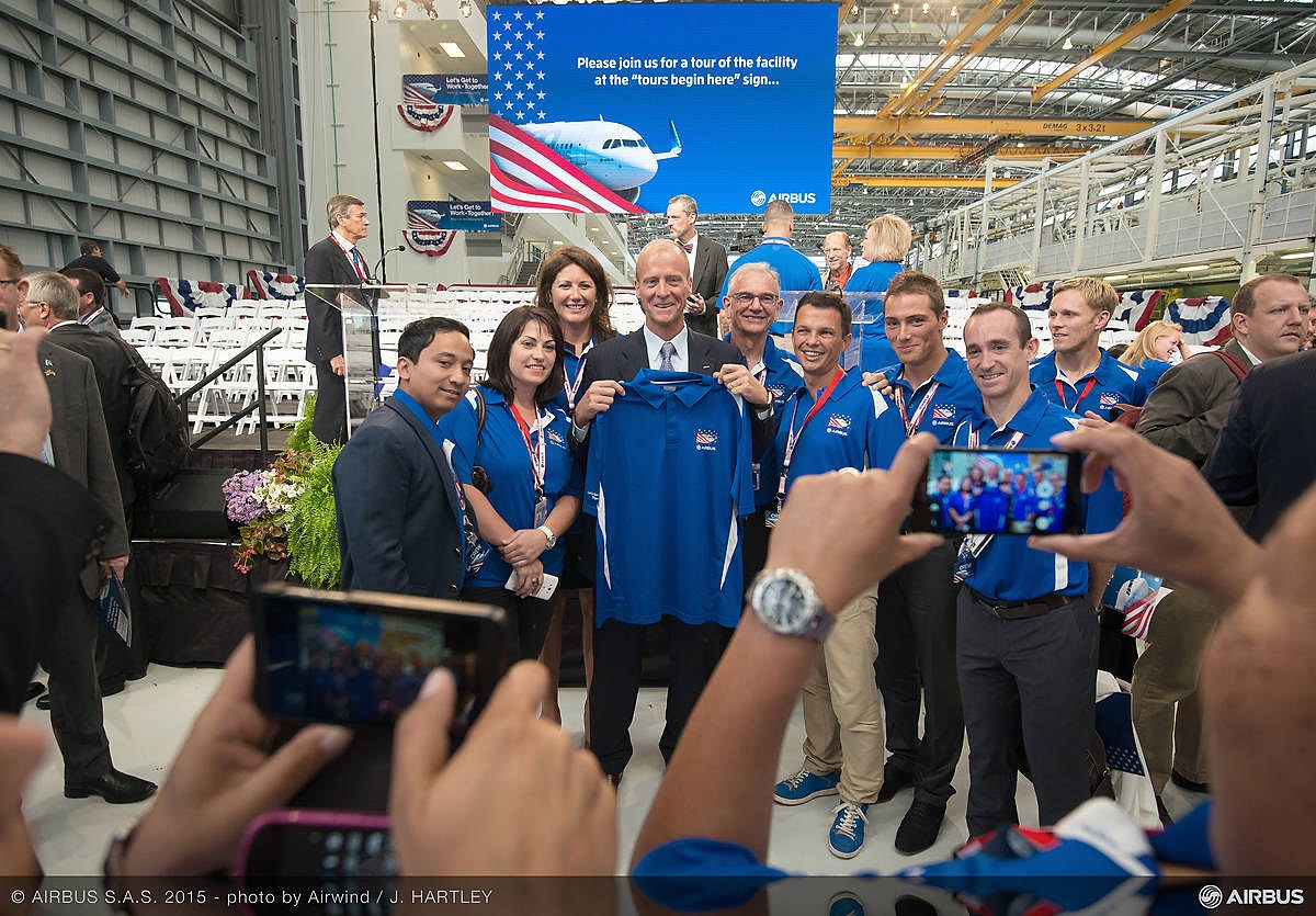 Abhinav Karki with the Airbus team at the Airbus A320 final assembly line in Mobile, Alabama, 2015