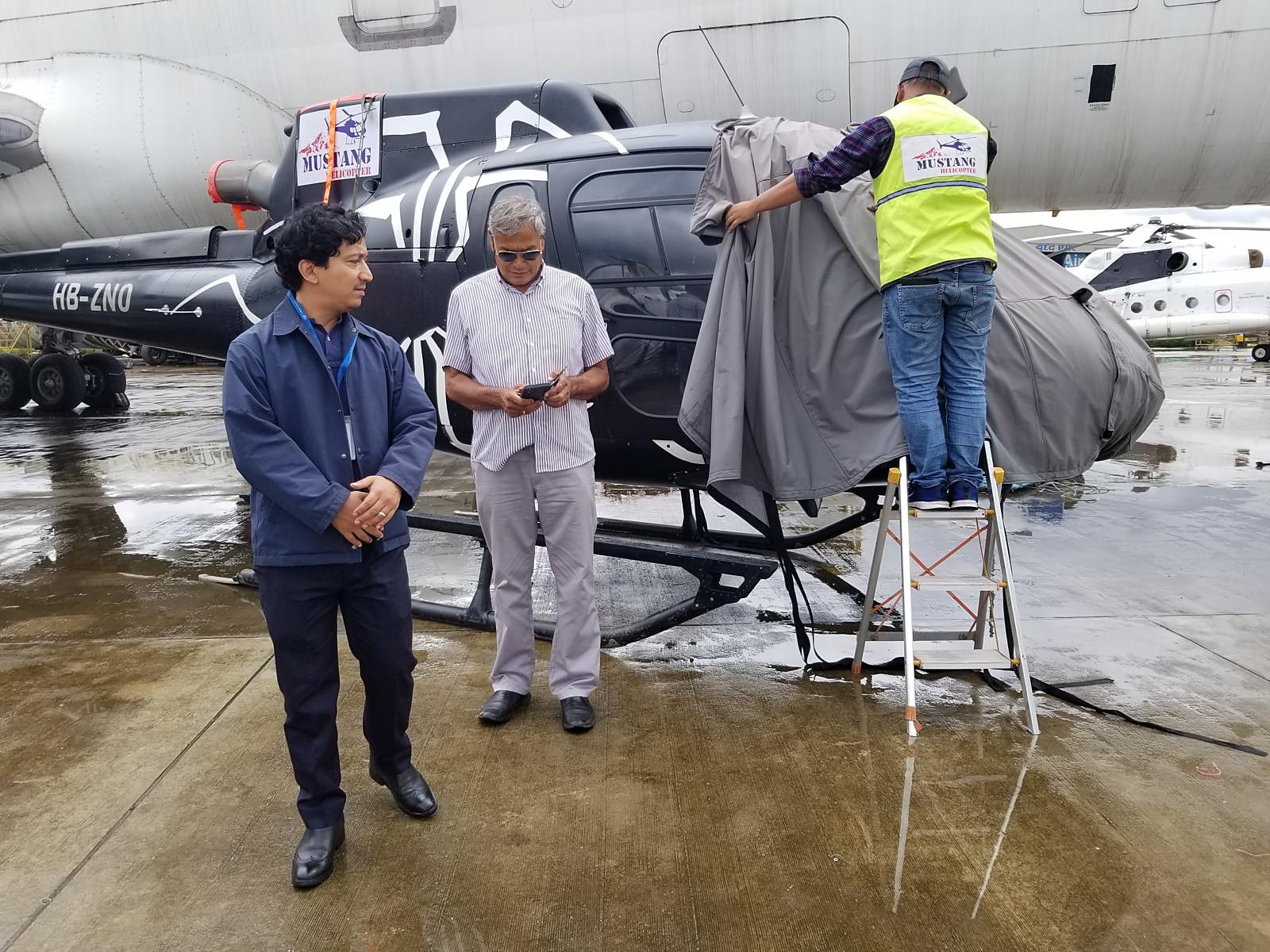 Abhinav Karki with a Mustang Helicopter aircraft in Kathmandu